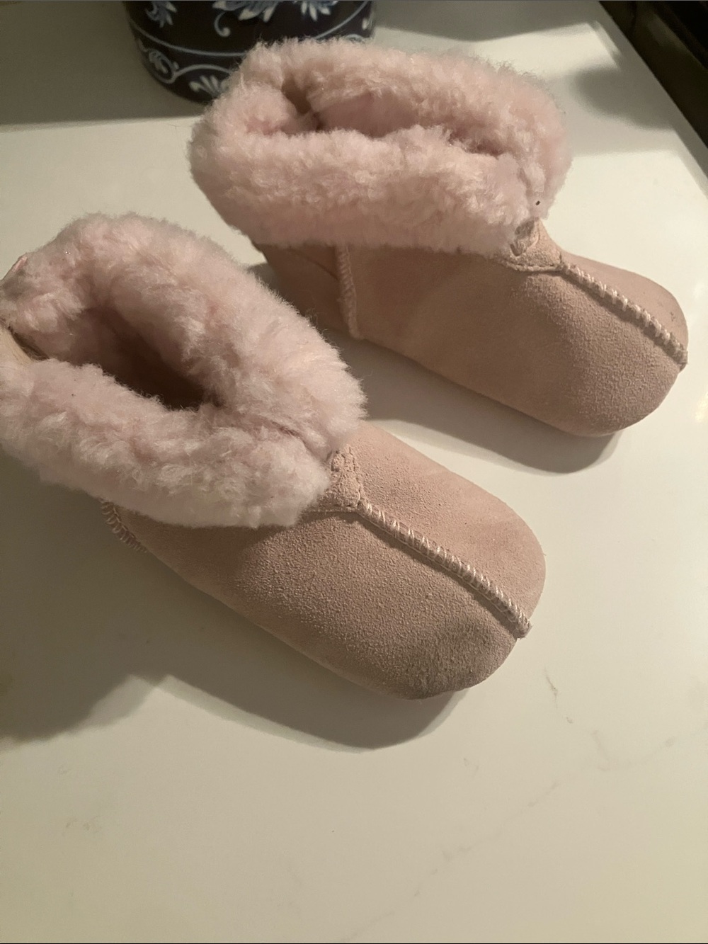 UGG Baby Cozy 04/05 Faux-Shearling Footies in Pale Pink